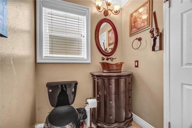 5927 E Creekside Ave Unit 18, Orange, CA 92869 - bathroom with toilet and baseboards