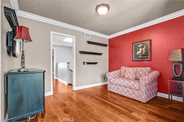 5927 E Creekside Ave Unit 18, Orange, CA 92869 - sitting room featuring ornamental molding, wood finished floors, baseboards, and an upstairs landing