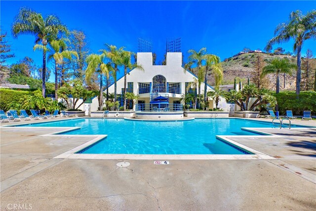 5927 E Creekside Ave Unit 18, Orange, CA 92869 - community pool featuring a patio