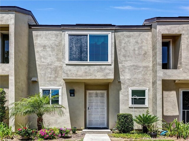 5927 E Creekside Ave Unit 18, Orange, CA 92869 - property entrance with stucco siding