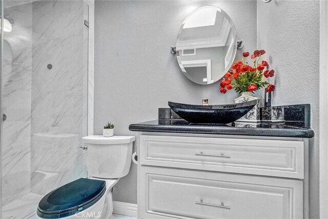 5927 E Creekside Ave Unit 18, Orange, CA 92869 - bathroom featuring vanity, toilet, and walk in shower