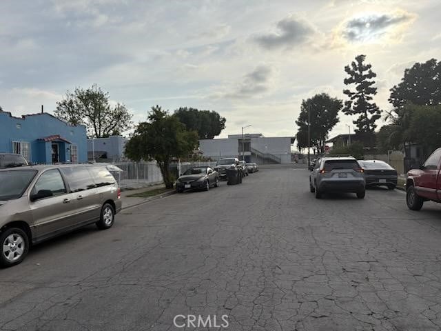 1413 E 77th St, Los Angeles, CA 90001 - view of asphalt street featuring a residential view