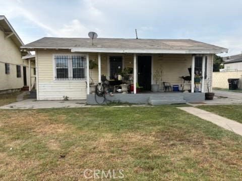 1413 E 77th St, Los Angeles, CA 90001 - back of house featuring a patio area and a lawn