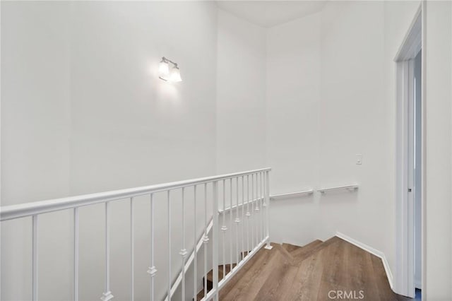 2601 E 19th St Unit 30, Signal Hill, CA 90755 - hall with wood finished floors and an upstairs landing