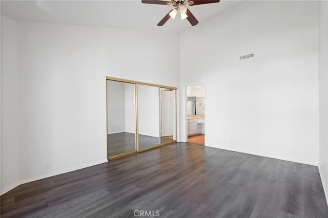 2601 E 19th St Unit 30, Signal Hill, CA 90755 - unfurnished bedroom with wood finished floors, a closet, ensuite bath, a ceiling fan, and high vaulted ceiling