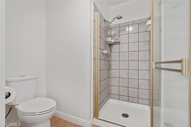 2601 E 19th St Unit 30, Signal Hill, CA 90755 - bathroom featuring a shower stall, toilet, tile patterned flooring, and baseboards