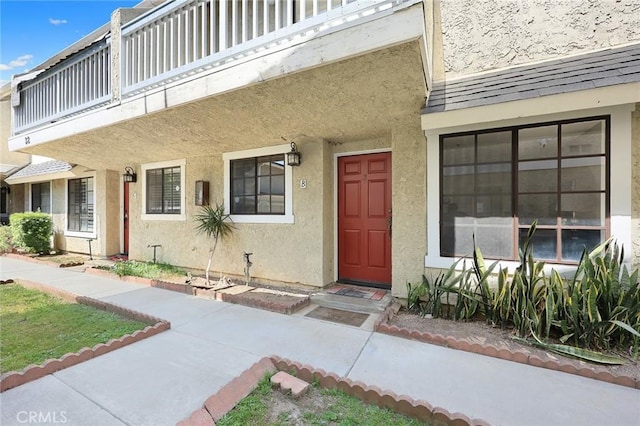 32 N 4th St Unit B, Alhambra, CA 91801 - view of exterior entry featuring stucco siding and a balcony
