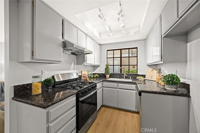 32 N 4th St Unit B, Alhambra, CA 91801 - kitchen featuring stainless steel range with gas cooktop, under cabinet range hood, a sink, a raised ceiling, and light wood-type flooring