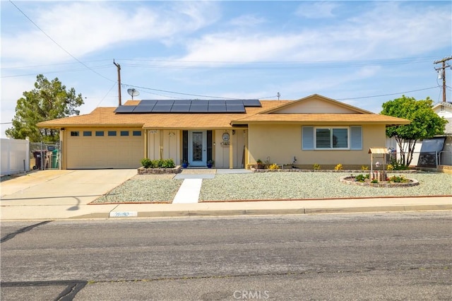 26190 Ridgemoor Rd, Menifee, CA 92586 - ranch-style house featuring a garage, driveway, and solar panels