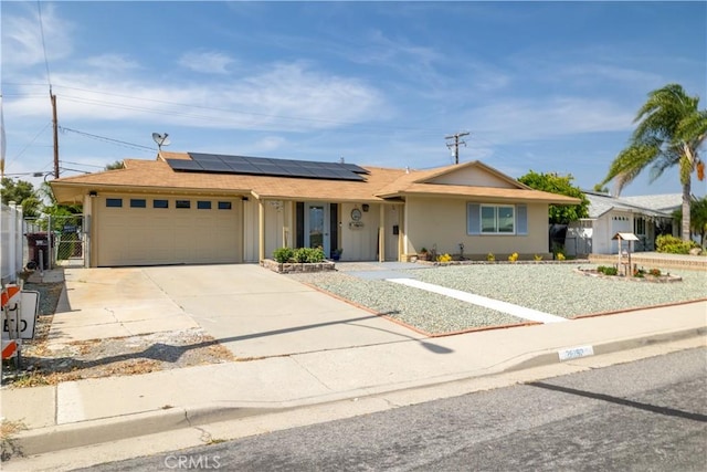 26190 Ridgemoor Rd, Menifee, CA 92586 - single story home with solar panels, an attached garage, concrete driveway, and a gate