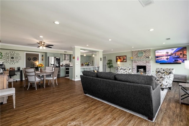 26190 Ridgemoor Rd, Menifee, CA 92586 - living room featuring ornamental molding, recessed lighting, wood finished floors, a fireplace, and a ceiling fan