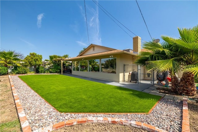 26190 Ridgemoor Rd, Menifee, CA 92586 - rear view of property with a gate, stucco siding, and a chimney