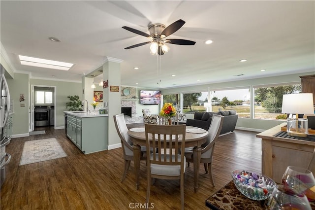 26190 Ridgemoor Rd, Menifee, CA 92586 - dining area featuring crown molding, dark wood-style flooring, baseboards, a ceiling fan, and recessed lighting