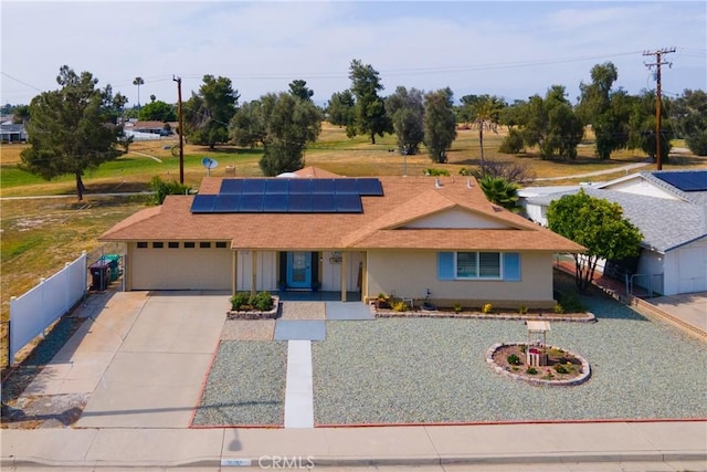 26190 Ridgemoor Rd, Menifee, CA 92586 - view of front of house featuring a garage, concrete driveway, solar panels, roof with shingles, and covered porch