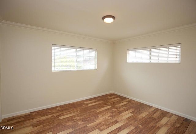 1207 S L St, Oxnard, CA 93033 - spare room featuring plenty of natural light, crown molding, and wood finished floors
