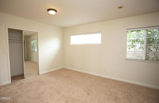 1207 S L St, Oxnard, CA 93033 - unfurnished bedroom featuring light carpet and a closet