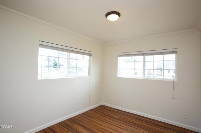 1207 S L St, Oxnard, CA 93033 - unfurnished room featuring healthy amount of natural light, crown molding, and dark wood-style floors