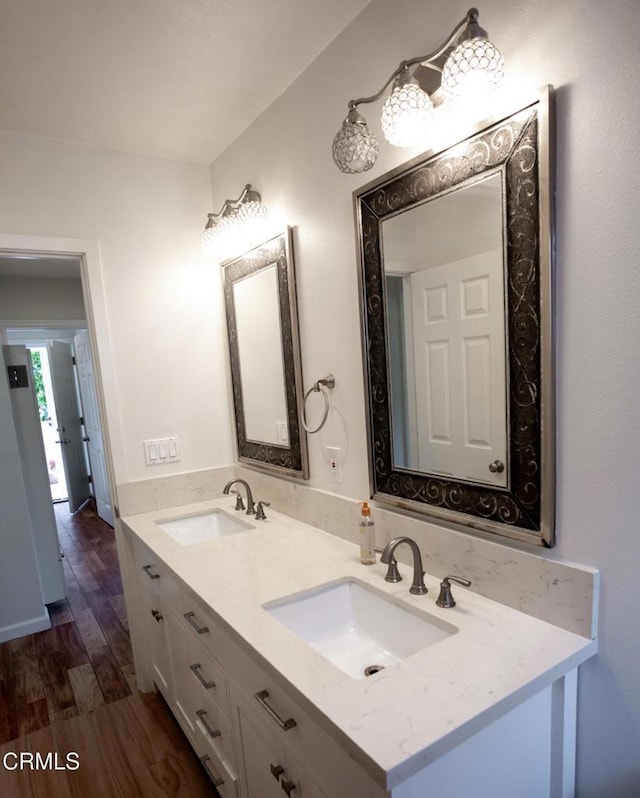 1207 S L St, Oxnard, CA 93033 - bathroom featuring double vanity and wood finished floors