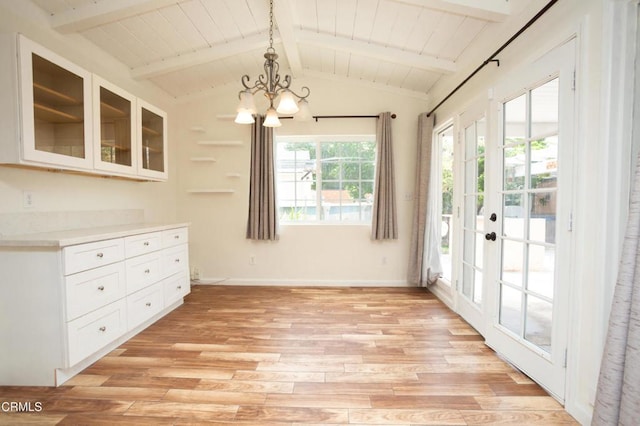 1207 S L St, Oxnard, CA 93033 - unfurnished dining area with a chandelier, light wood-type flooring, wood ceiling, and french doors