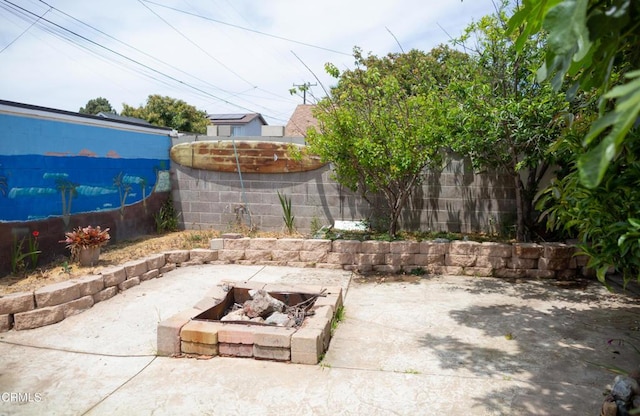 1207 S L St, Oxnard, CA 93033 - fenced backyard with an outdoor fire pit and a patio area