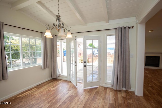 1207 S L St, Oxnard, CA 93033 - unfurnished dining area featuring wood finished floors, a chandelier, french doors, and wood ceiling