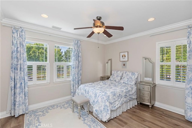 8851 Soothing Ct, Corona, CA 92883 - bedroom with baseboards, wood finished floors, crown molding, a ceiling fan, and recessed lighting