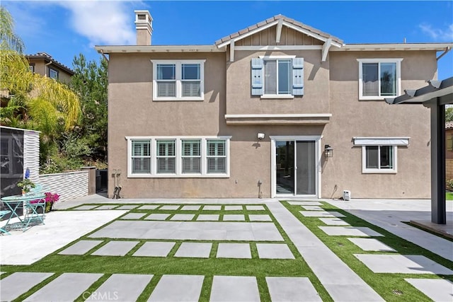 8851 Soothing Ct, Corona, CA 92883 - rear view of house with a patio, stucco siding, and a chimney