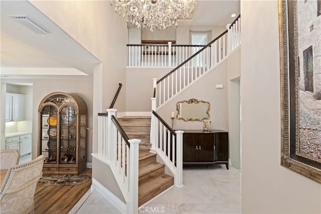 8851 Soothing Ct, Corona, CA 92883 - stairway featuring a chandelier