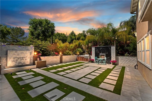 8851 Soothing Ct, Corona, CA 92883 - yard at dusk featuring a patio