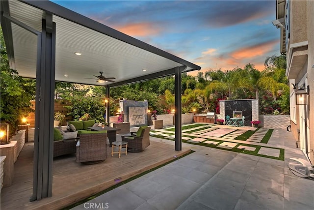 8851 Soothing Ct, Corona, CA 92883 - patio terrace at dusk with outdoor lounge area, a ceiling fan, and a patio