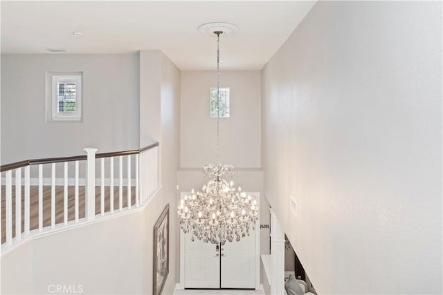 8851 Soothing Ct, Corona, CA 92883 - entryway featuring healthy amount of natural light and a chandelier