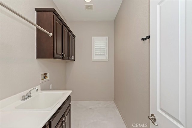 8851 Soothing Ct, Corona, CA 92883 - washroom with washer hookup and cabinet space
