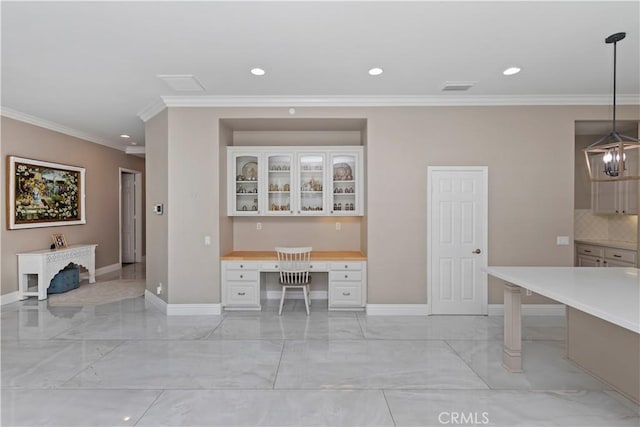 8851 Soothing Ct, Corona, CA 92883 - kitchen featuring light marble finish flooring, baseboards, crown molding, and recessed lighting