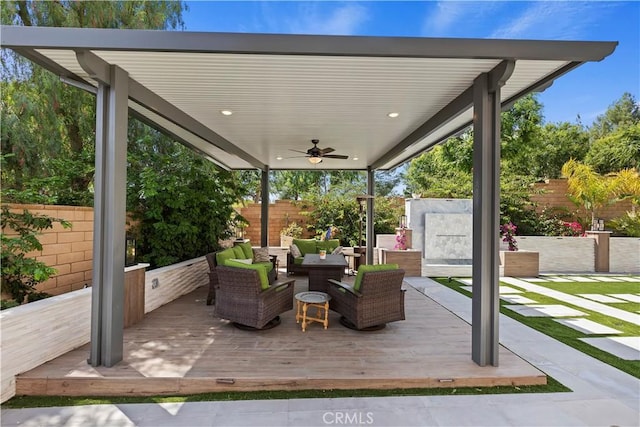8851 Soothing Ct, Corona, CA 92883 - fenced backyard with a ceiling fan and outdoor lounge area