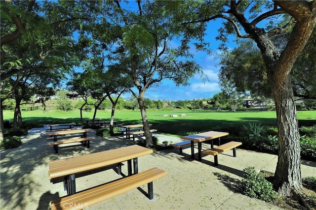 8851 Soothing Ct, Corona, CA 92883 - surrounding community with a yard and a patio area