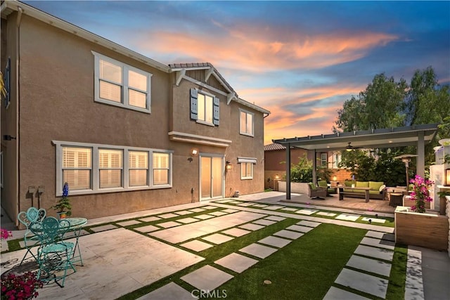 8851 Soothing Ct, Corona, CA 92883 - rear view of house featuring outdoor lounge area, a patio, stucco siding, and a pergola