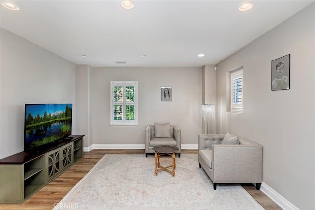 8851 Soothing Ct, Corona, CA 92883 - sitting room with light wood-style flooring, baseboards, and recessed lighting
