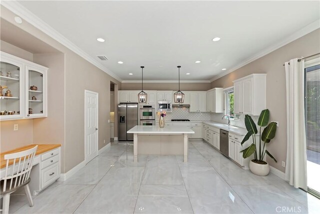 8851 Soothing Ct, Corona, CA 92883 - kitchen featuring stainless steel appliances, a sink, white cabinetry, a kitchen island, and light countertops
