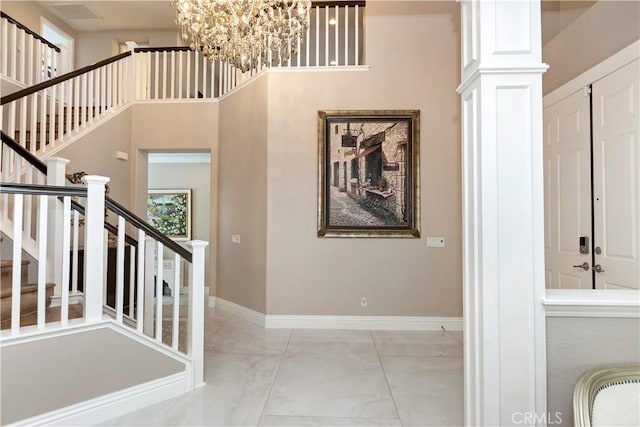 8851 Soothing Ct, Corona, CA 92883 - stairs featuring a chandelier, marble finish floors, and baseboards