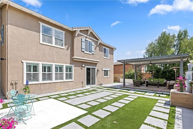 8851 Soothing Ct, Corona, CA 92883 - back of house featuring an outdoor living space, a patio, and stucco siding