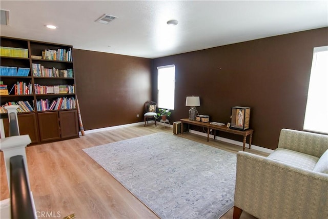 24649 Round Meadow Dr, Menifee, CA 92584 - living area featuring light wood-type flooring, baseboards, and recessed lighting