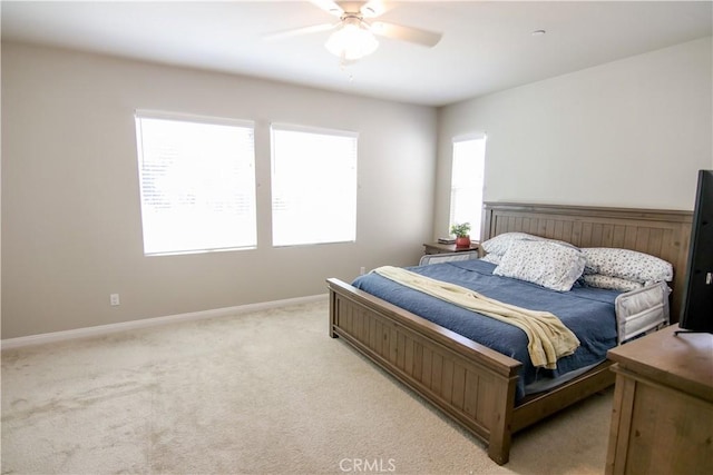 24649 Round Meadow Dr, Menifee, CA 92584 - bedroom featuring baseboards, light carpet, and a ceiling fan