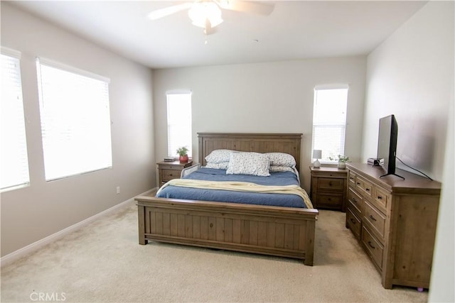 24649 Round Meadow Dr, Menifee, CA 92584 - bedroom with light carpet, multiple windows, baseboards, and a ceiling fan