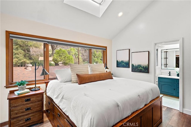 31342 Silverado Canyon Rd, Silverado Canyon, CA 92676 - bedroom with a skylight, wood finished floors, high vaulted ceiling, ensuite bath, and recessed lighting