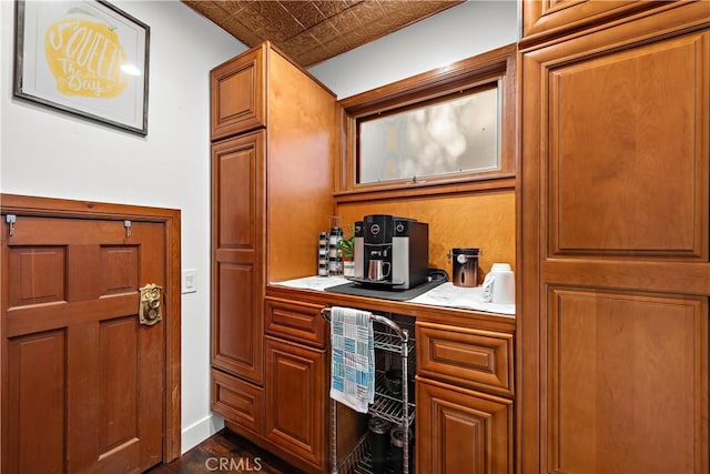 31342 Silverado Canyon Rd, Silverado Canyon, CA 92676 - bar featuring an ornate ceiling, dark wood-style floors, and baseboards
