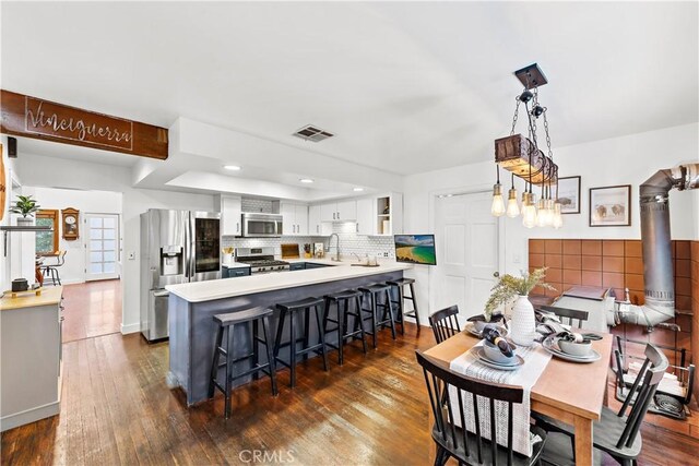 31342 Silverado Canyon Rd, Silverado Canyon, CA 92676 - dining room featuring dark wood finished floors, recessed lighting, and baseboards