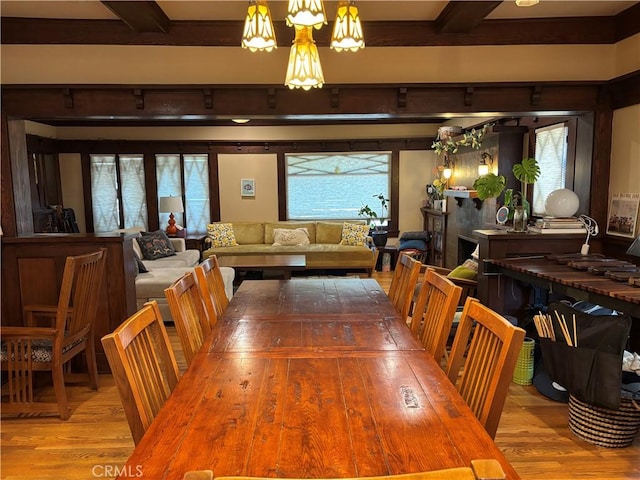163 S Kingsley, Los Angeles, CA 90004 - dining area with wood finished floors, beam ceiling, and a chandelier
