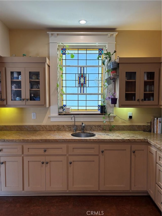 163 S Kingsley, Los Angeles, CA 90004 - kitchen featuring a sink, glass insert cabinets, and light stone counters