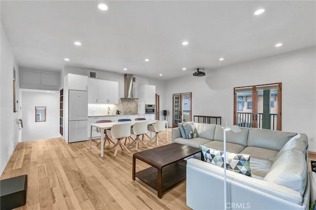 163 S Kingsley, Los Angeles, CA 90004 - living room featuring light wood finished floors and recessed lighting