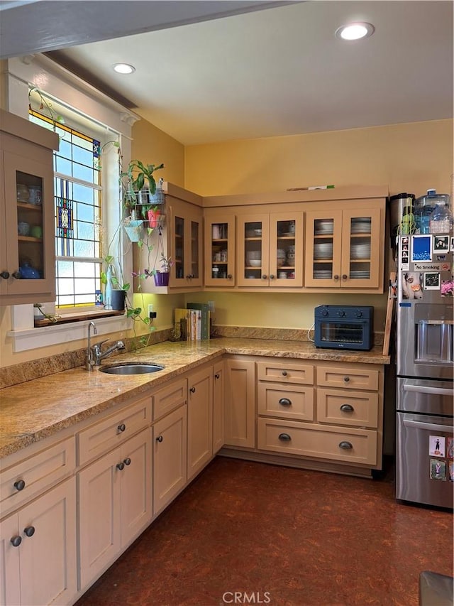 163 S Kingsley, Los Angeles, CA 90004 - kitchen featuring stainless steel refrigerator with ice dispenser, a sink, light stone countertops, glass insert cabinets, and recessed lighting
